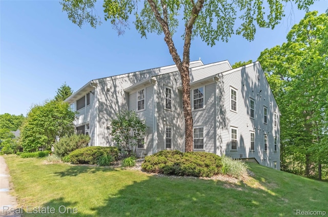 12267 Saint Andrews Way, Fenton, MI 48430 - view of front of house with a front lawn