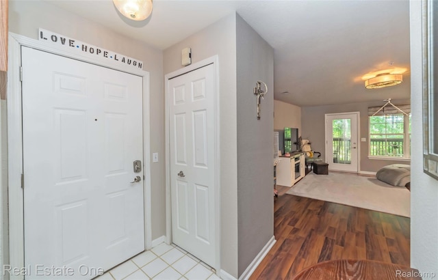 12267 Saint Andrews Way, Fenton, MI 48430 - foyer entrance with baseboards and wood finished floors
