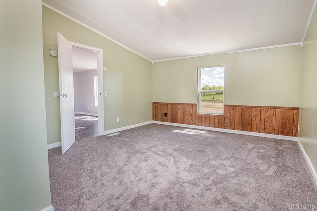 5730 Cavendar Dr, Mount Pleasant, MI 48883 - carpeted spare room featuring ornamental molding, a wainscoted wall, vaulted ceiling, wood walls, and a smoke detector