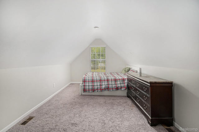 816 Nelsons Ridge Dr, Howell, MI 48843 - carpeted bedroom featuring vaulted ceiling and baseboards