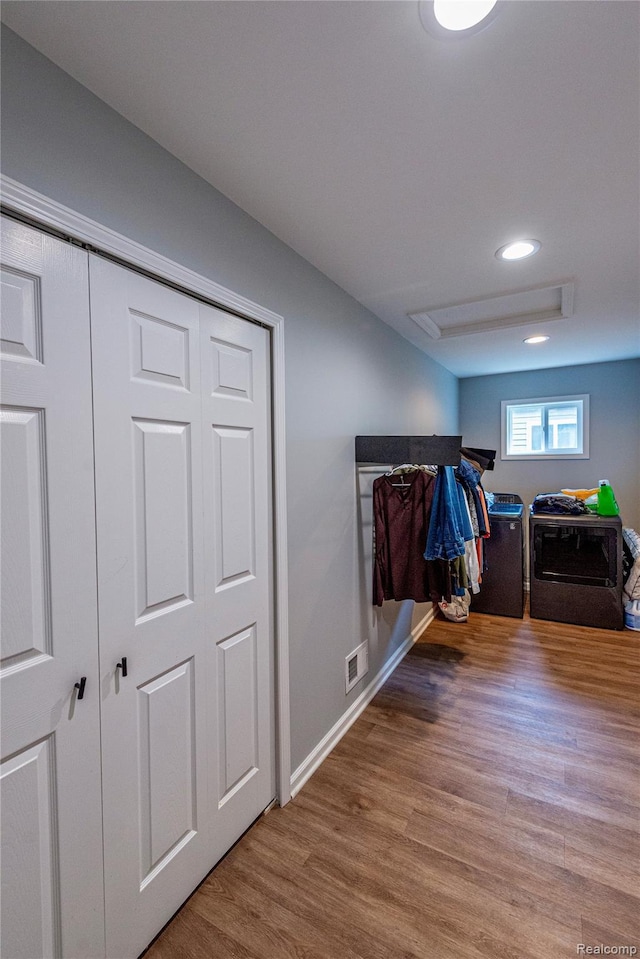 3982 Ontario Dr, Auburn Hills, MI 48326 - corridor with attic access, wood finished floors, recessed lighting, and separate washer and dryer