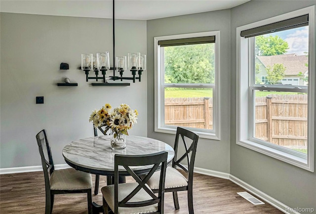 3982 Ontario Dr, Auburn Hills, MI 48326 - dining room featuring baseboards and wood finished floors