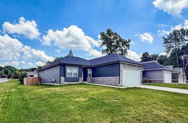 3982 Ontario Dr, Auburn Hills, MI 48326 - view of front facade featuring a garage, driveway, and stone siding