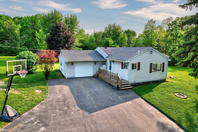 2284 E Frances Rd, Clio, MI 48420 - single story home with a garage, driveway, a front yard, and a shingled roof