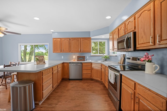 2284 E Frances Rd, Clio, MI 48420 - kitchen featuring stainless steel appliances, a peninsula, ceiling fan, light countertops, and recessed lighting