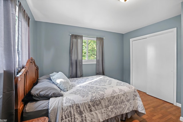 2284 E Frances Rd, Clio, MI 48420 - bedroom featuring wood finished floors and a closet