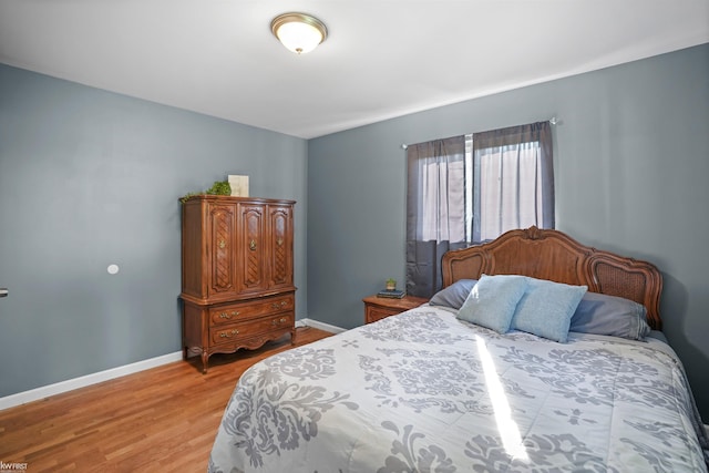 2284 E Frances Rd, Clio, MI 48420 - bedroom with light wood-style flooring and baseboards