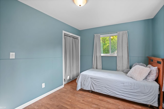 2284 E Frances Rd, Clio, MI 48420 - bedroom featuring wood finished floors and baseboards