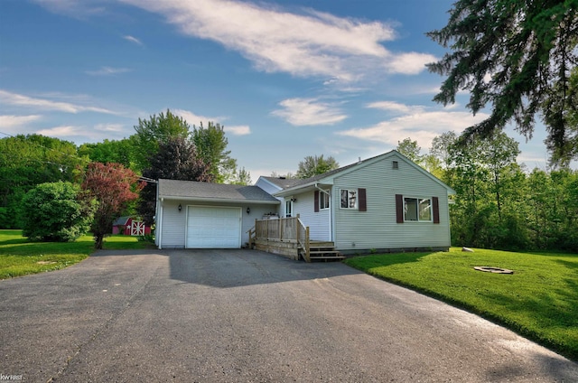 2284 E Frances Rd, Clio, MI 48420 - ranch-style home with driveway, a front yard, and a garage