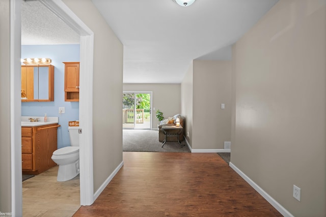 2284 E Frances Rd, Clio, MI 48420 - hall featuring light wood-style flooring and baseboards