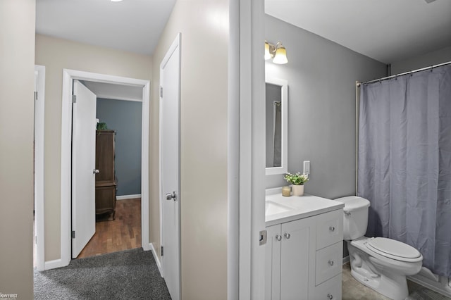 2284 E Frances Rd, Clio, MI 48420 - bathroom featuring vanity, toilet, baseboards, and a shower with shower curtain