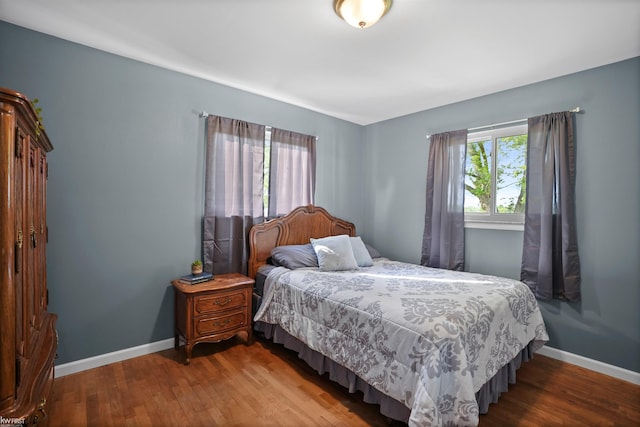 2284 E Frances Rd, Clio, MI 48420 - bedroom featuring wood finished floors and baseboards