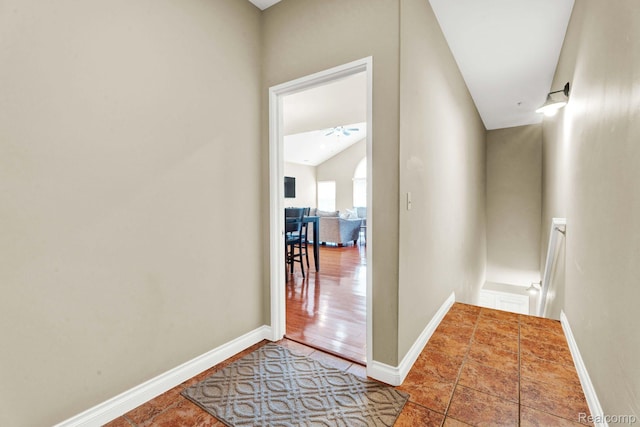 48888 Amanda Ln, Shelby Twp, MI 48317 - corridor with an upstairs landing, baseboards, and lofted ceiling