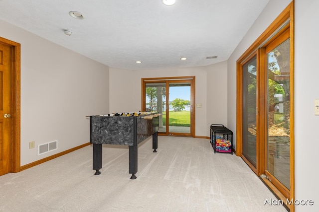 6574 Gran Via Dr NE, Rockford, MI 49341 - rec room with baseboards, light carpet, and recessed lighting