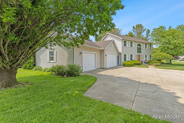 6574 Gran Via Dr NE, Rockford, MI 49341 - colonial home with an attached garage, driveway, a front lawn, and a shingled roof