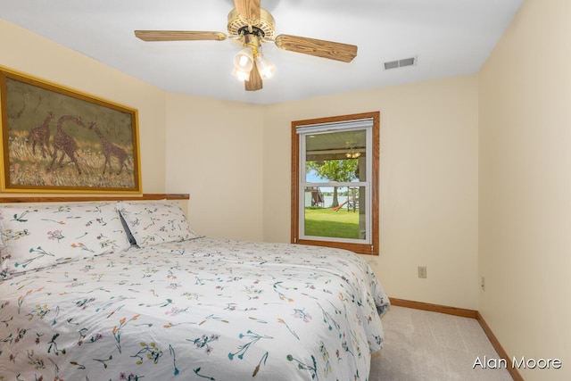 6574 Gran Via Dr NE, Rockford, MI 49341 - bedroom featuring light colored carpet, baseboards, and ceiling fan