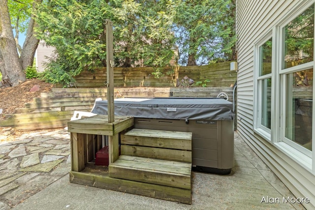 6574 Gran Via Dr NE, Rockford, MI 49341 - view of patio / terrace featuring a hot tub