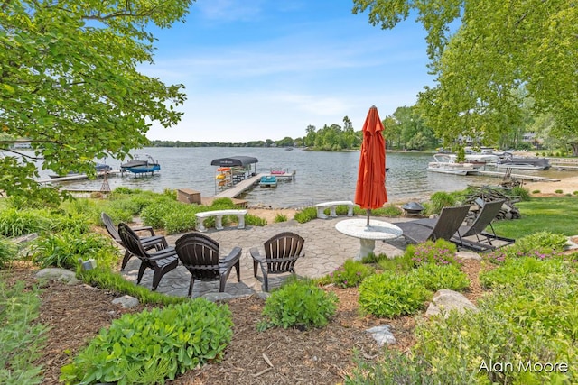6574 Gran Via Dr NE, Rockford, MI 49341 - view of patio / terrace with a dock, a water view, and a fire pit