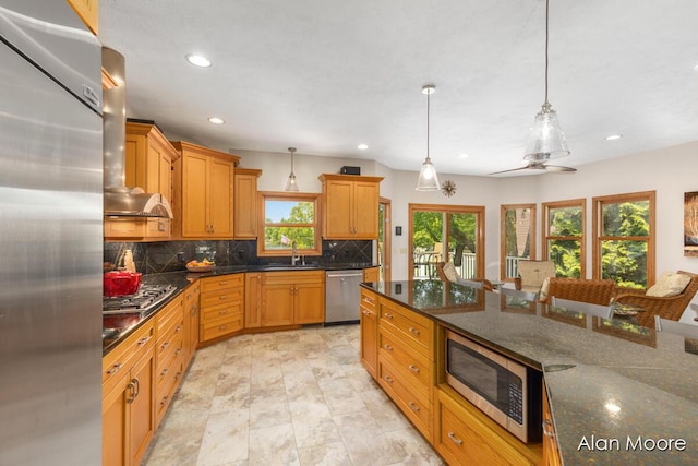 6574 Gran Via Dr NE, Rockford, MI 49341 - kitchen with appliances with stainless steel finishes, decorative backsplash, recessed lighting, decorative light fixtures, and a sink