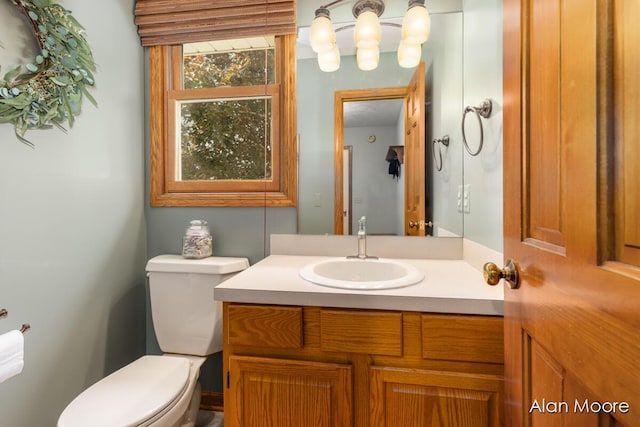 6574 Gran Via Dr NE, Rockford, MI 49341 - half bathroom featuring toilet and vanity