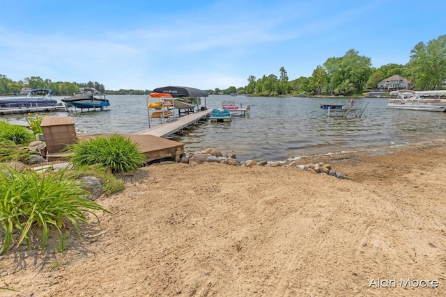 6574 Gran Via Dr NE, Rockford, MI 49341 - dock area featuring a water view and boat lift