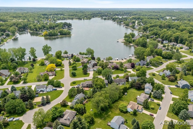 6574 Gran Via Dr NE, Rockford, MI 49341 - aerial view of residential area featuring a nearby body of water and a forest