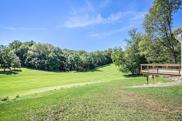 233 Markus Glen Dr, Plainwell, MI 49080 - view of green lawn featuring a wooden deck and view of golf course