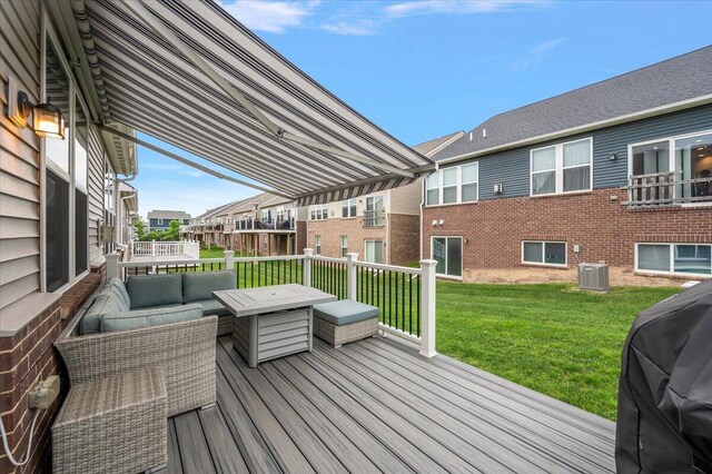 2765 Polson St, Ann Arbor, MI 48105 - wooden terrace featuring an outdoor living space, a lawn, central air condition unit, and a residential view