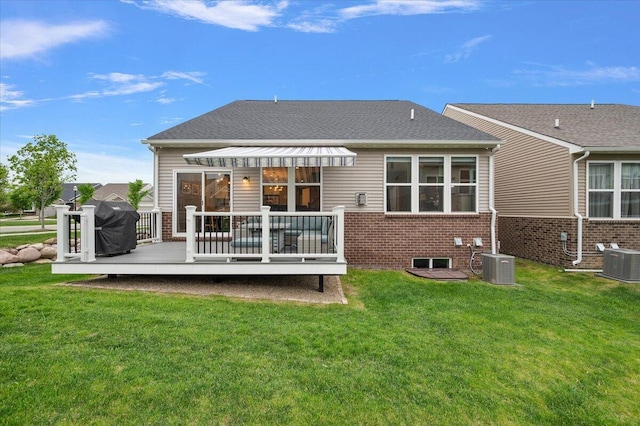 2765 Polson St, Ann Arbor, MI 48105 - rear view of property with central AC, brick siding, a deck, and a lawn