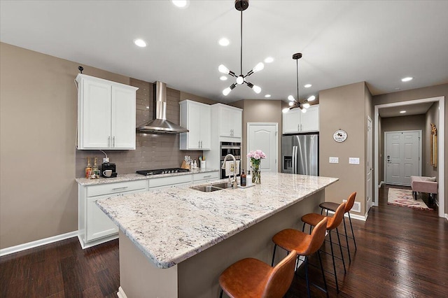2765 Polson St, Ann Arbor, MI 48105 - kitchen with stainless steel appliances, wall chimney range hood, a sink, baseboards, and dark wood-style floors