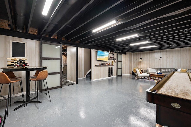 2765 Polson St, Ann Arbor, MI 48105 - finished basement with stairway, wooden walls, and baseboards