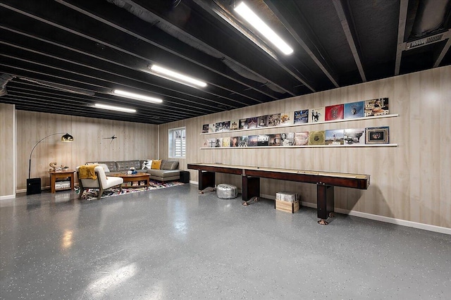 2765 Polson St, Ann Arbor, MI 48105 - misc room with speckled floor, baseboards, and wood walls
