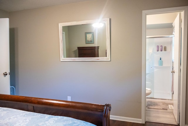 4873 Terrace Ln, Saint Joseph, MI 49085 - bedroom featuring baseboards, wood finished floors, and ensuite bathroom