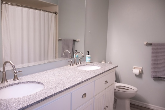 4873 Terrace Ln, Saint Joseph, MI 49085 - full bathroom featuring toilet and double vanity