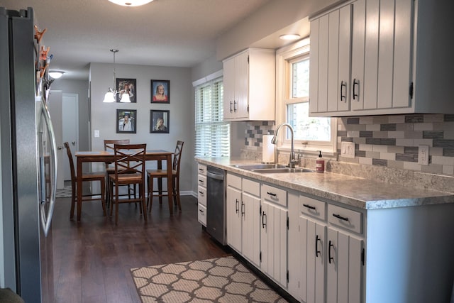 4873 Terrace Ln, Saint Joseph, MI 49085 - kitchen with a sink, stainless steel appliances, backsplash, and dark wood-style floors