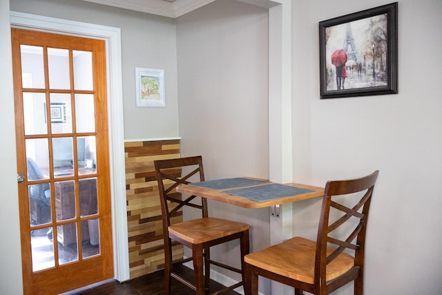 4873 Terrace Ln, Saint Joseph, MI 49085 - dining area featuring crown molding and dark wood-style flooring