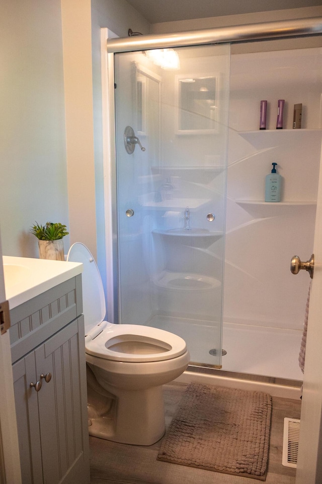 4873 Terrace Ln, Saint Joseph, MI 49085 - full bathroom featuring toilet, a stall shower, and vanity
