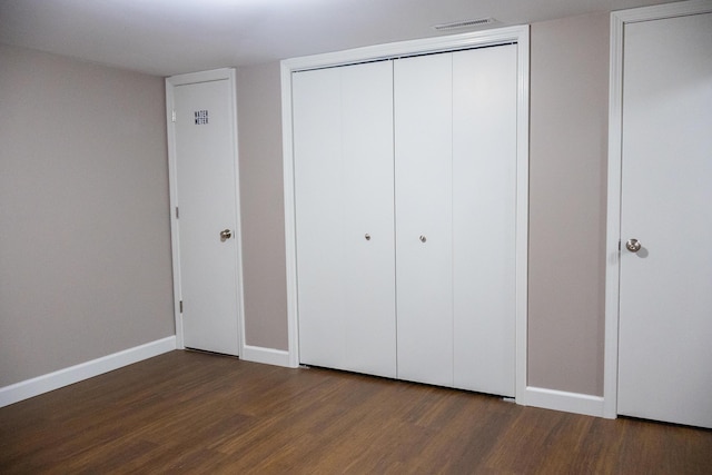 4873 Terrace Ln, Saint Joseph, MI 49085 - unfurnished bedroom featuring wood finished floors and baseboards
