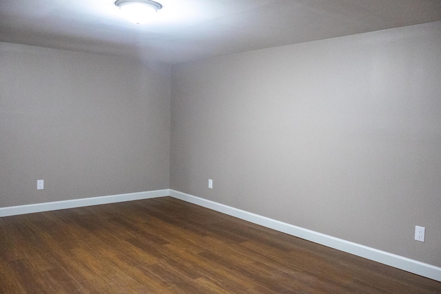 4873 Terrace Ln, Saint Joseph, MI 49085 - unfurnished room featuring dark wood finished floors and baseboards