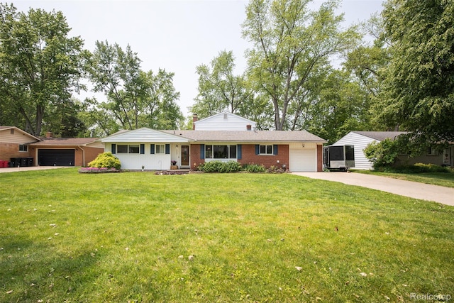 17733 Deering St, Livonia, MI 48152 - ranch-style house featuring brick siding, driveway, an attached garage, and a front yard