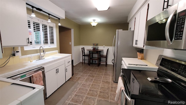 17733 Deering St, Livonia, MI 48152 - kitchen featuring electric stove, stainless steel microwave, white cabinetry, and tile countertops