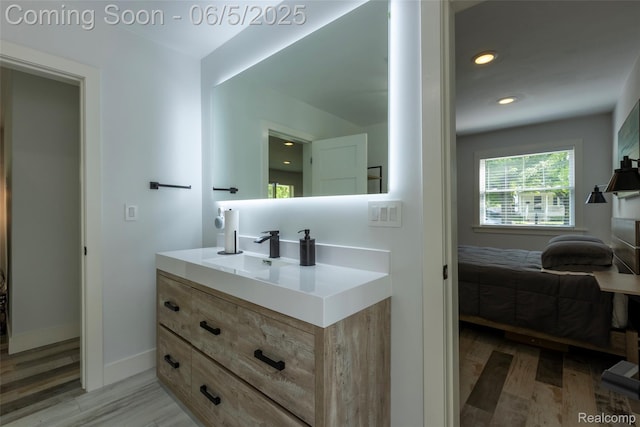 343 Beaupre Ave, Grosse Pointe Farms, MI 48236 - bathroom featuring vanity, baseboards, wood finished floors, and recessed lighting