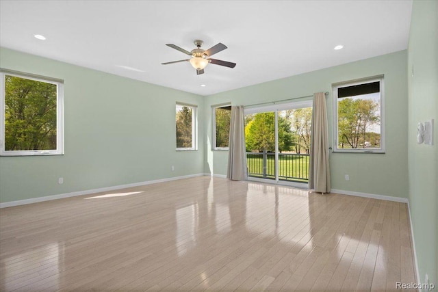 12150 Shaffer Rd, Davisburg, MI 48350 - empty room featuring plenty of natural light, baseboards, ceiling fan, light wood-type flooring, and recessed lighting