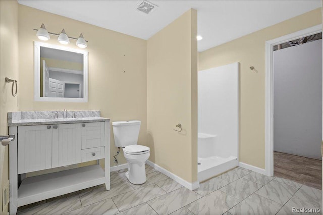 12150 Shaffer Rd, Davisburg, MI 48350 - full bath with vanity, marble finish floors, toilet, baseboards, and a walk in shower