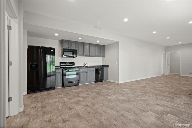 12150 Shaffer Rd, Davisburg, MI 48350 - kitchen with black appliances, gray cabinets, light wood-style floors, recessed lighting, and baseboards