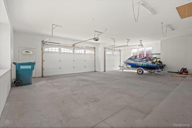 12150 Shaffer Rd, Davisburg, MI 48350 - garage featuring a garage door opener