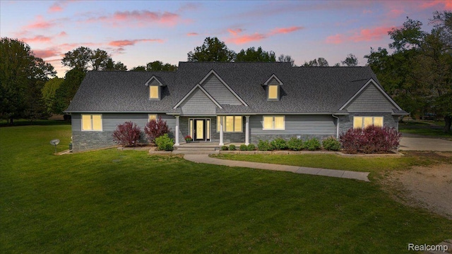 12150 Shaffer Rd, Davisburg, MI 48350 - view of front of property with stone siding and a lawn