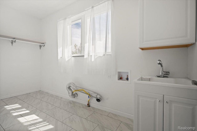 12150 Shaffer Rd, Davisburg, MI 48350 - washroom featuring hookup for a washing machine, a sink, baseboards, and light marble finish flooring
