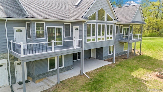 12150 Shaffer Rd, Davisburg, MI 48350 - back of property featuring a lawn, a patio area, a balcony, and a shingled roof