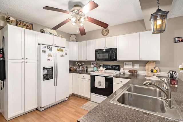 11135 Maple Ridge Way, Roscommon, MI 48653 - kitchen featuring white fridge with ice dispenser, black microwave, range with electric stovetop, a sink, and dark countertops